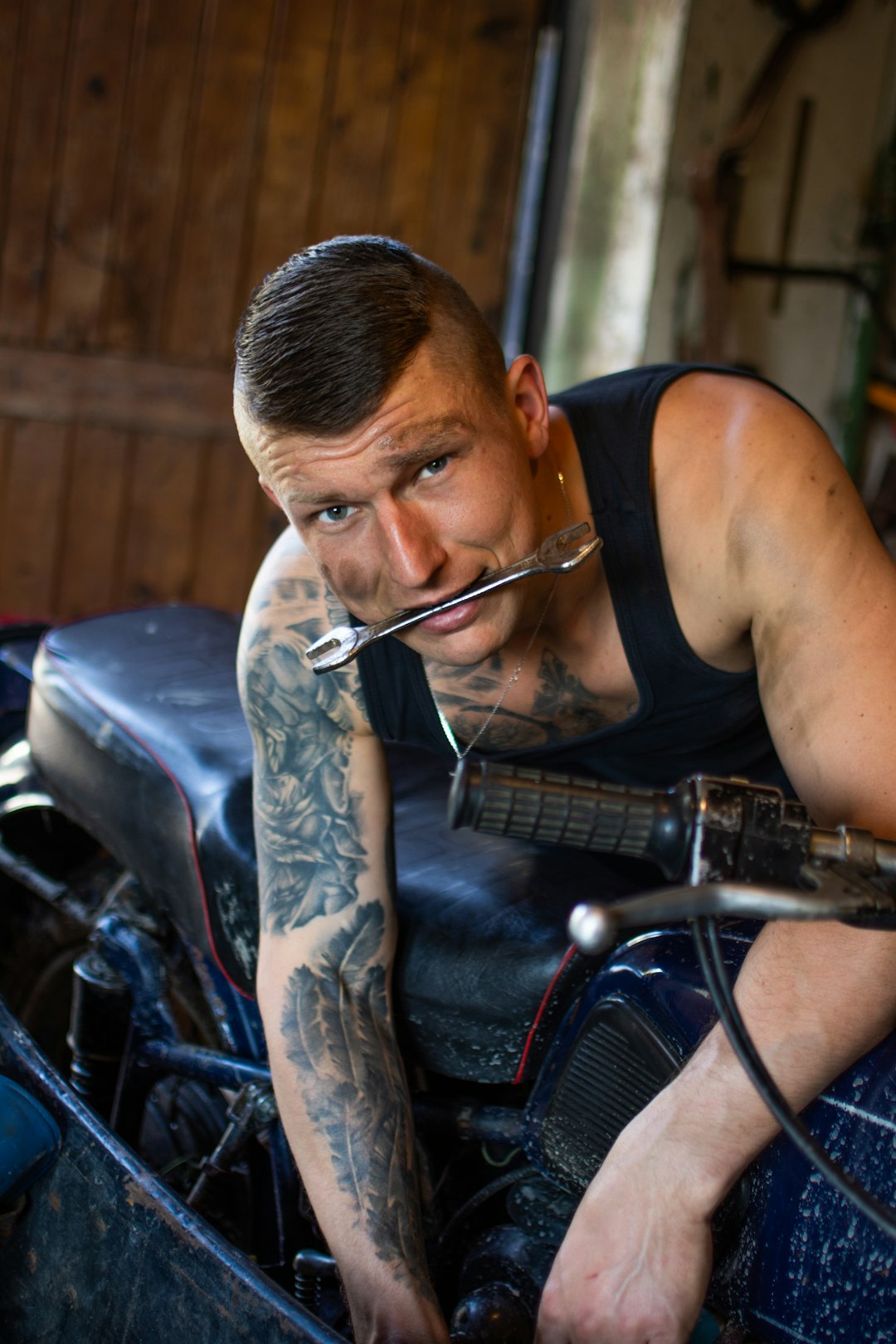 man-in-black-tank-top-playing-guitar-kfljljvkovo